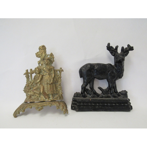 1411 - Two cast metal door stops courting couple and stag