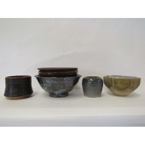 1423 - A collection of studio pottery bowls including facet sided example