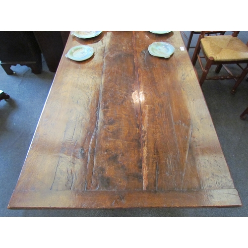 1123 - An oak refectory table with turned supports on sledge feet stretcher base, 198cm length, 83cm width,... 