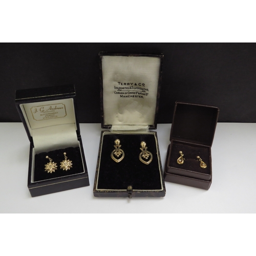 7066 - Three pairs of 9ct gold earrings including two pairs set with a small diamond, 6.8g