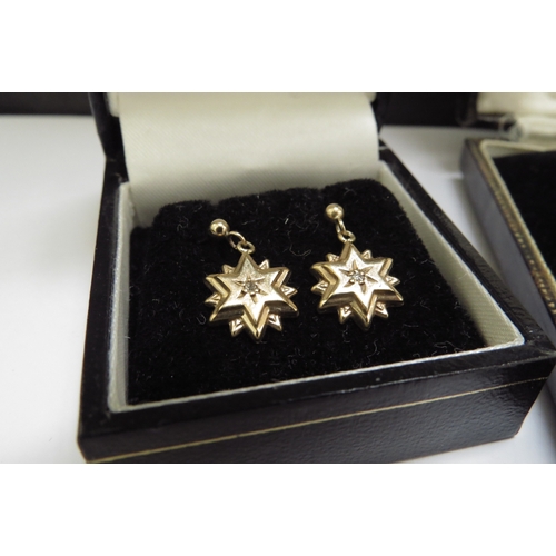 7066 - Three pairs of 9ct gold earrings including two pairs set with a small diamond, 6.8g