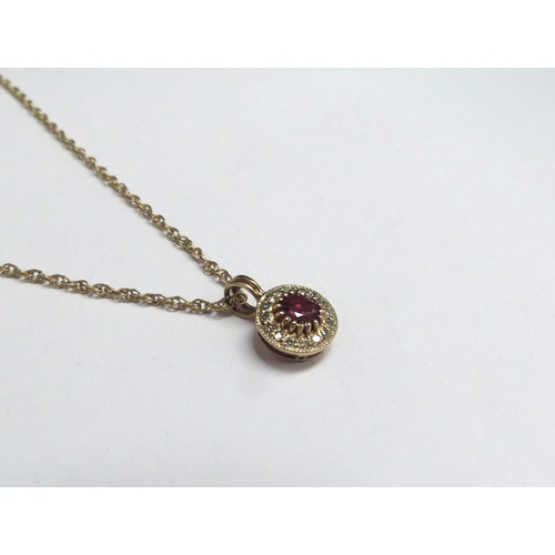 7093 - A ruby and diamond pendant hung on gold chain, stamped 9ct, 44cm long, 2.7g