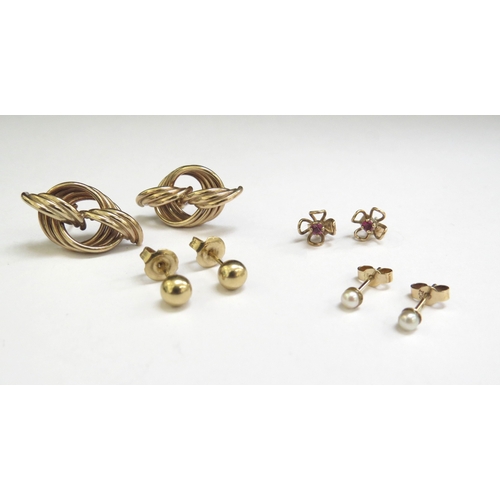 7071 - Three pairs of 9ct gold earrings including pearl studs, and ruby examples, 4g and a pair of unmarked... 