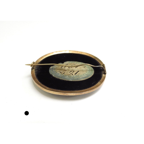 7006 - A Micro-Mosaic oval brooch depicting the Colosseum Rome, with a malachite border on black onyx, smal... 