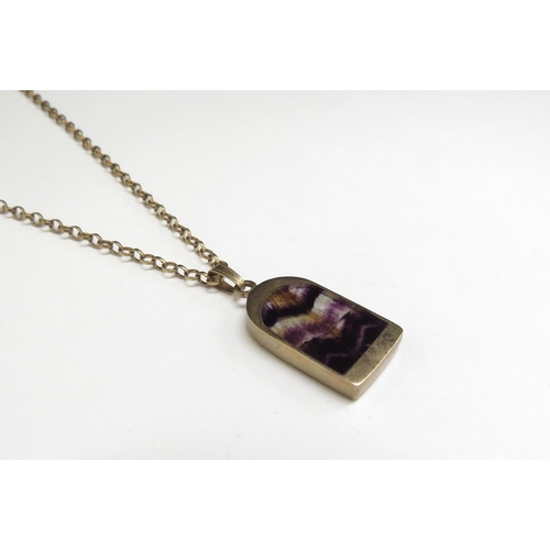 7414 - A 9ct gold necklace, 44cm long hung with a Blue John pendant, 22mm x 13mm, 6.2g