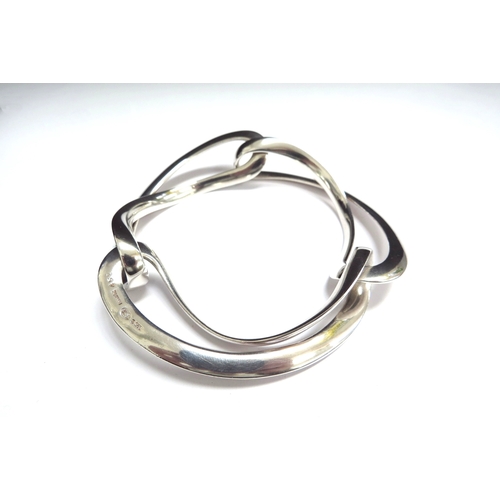 7098 - A Georg Jensen silver Infinity bangle by Regitze Overgaard #452, 57.7g, boxed