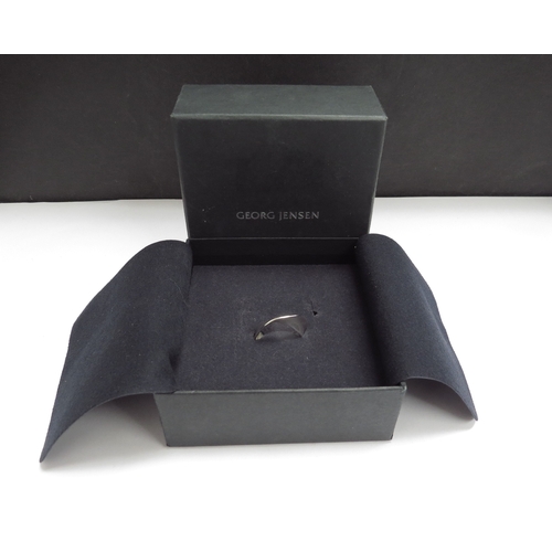 7104 - A Georg Jensen silver Mobius ring designed by Torun Bulow-Hube, #148. Size M, 3.9g, boxed