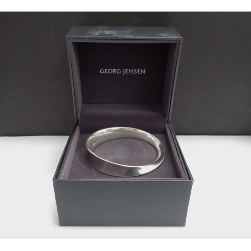 7096 - A Georg Jensen Mobius silver bangle designed by Vivianna Torun #206, 52.7g, boxed