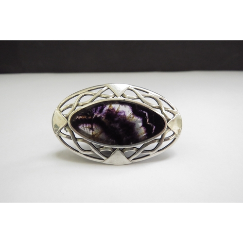 7413 - An oval silver brooch with central Blue John panel, 5cm x 3.3cm, 10.8g