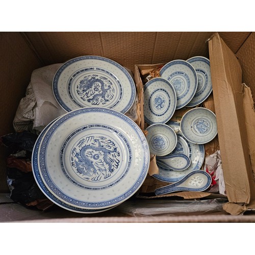 1217 - Three boxes of blue and white Chinese rice pattern dinner service, some a/f