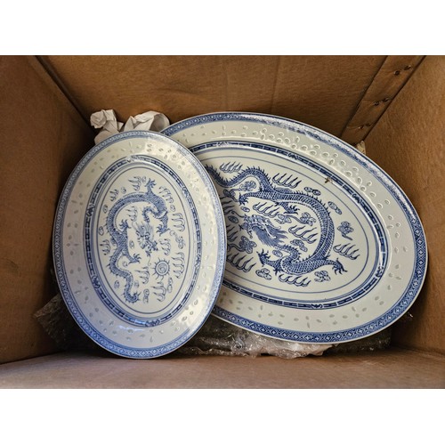 1217 - Three boxes of blue and white Chinese rice pattern dinner service, some a/f