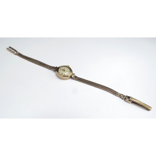 7407 - A 9ct gold Talis wristwatch with 9ct gold bracelet strap, 9.6g