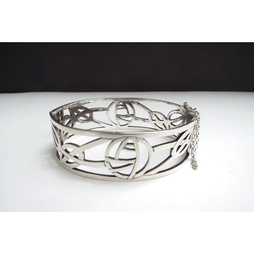 7072 - A silver Rennie Mackintosh design hinged bangle in original box