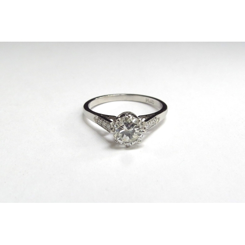 7023 - A single solitaire diamond ring with diamond set shoulders, stamped Plat 0.85ct approx. Size O, 3.7g