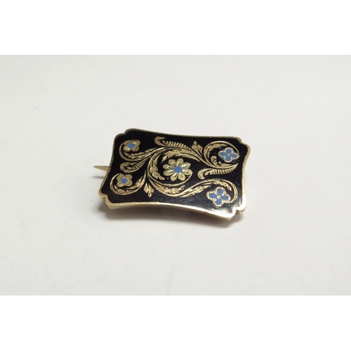 7030 - An early Victorian enamelled mourning brooch, 20mm x 14mm, hair panel back engraved 