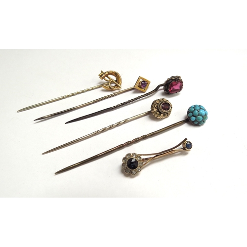 7075 - Four various stick pins including turquoise, amethyst and horseshoe and whip and a sapphire and diam... 