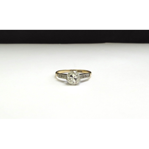 7001 - A diamond solitaire 1.25ct approx flanked by three 0.01ct diamonds to shoulders, 18ct/Plat. Size S, ... 