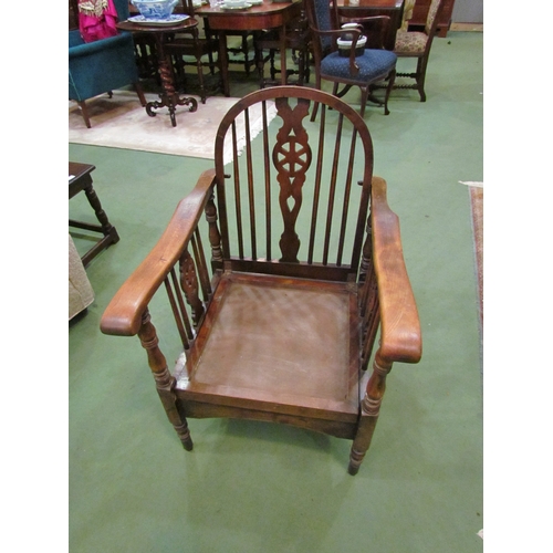 4069 - An oak wheel-back open armchair, ratchet form, stamped 2157  BB  (E)  £5-10