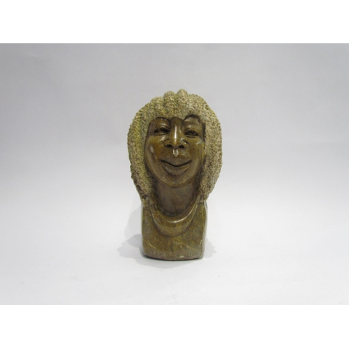 4115 - An African carved stone bust of lady, 19.5cm tall  (GROUP 4116)  £25-30