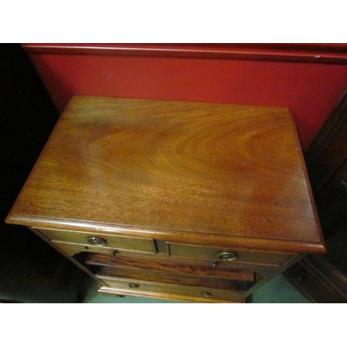 4131 - A George III revival flame mahogany side cabinet the two short drawers over a brushing slide and hei... 