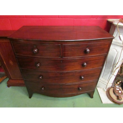 4160 - A Circa 1860 flame mahogany bow front chest of two short over three graduating long drawers with tur... 