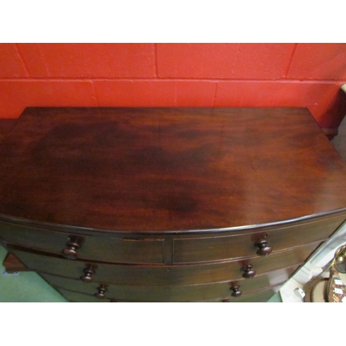 4160 - A Circa 1860 flame mahogany bow front chest of two short over three graduating long drawers with tur... 