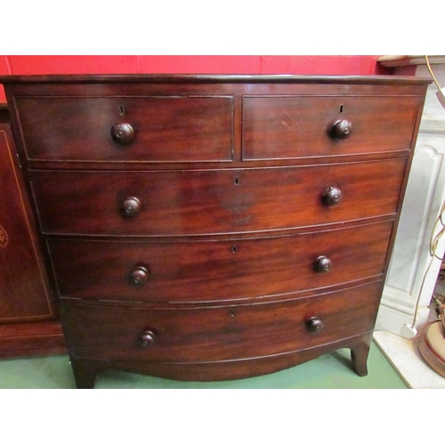 4160 - A Circa 1860 flame mahogany bow front chest of two short over three graduating long drawers with tur... 