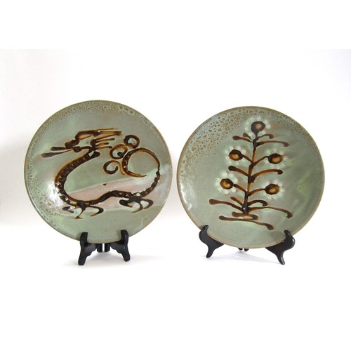 4209 - Two Mashiko Pottery plates by the same hand with pale olive glaze ground, one with painted dragon de... 