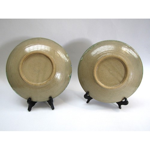 4209 - Two Mashiko Pottery plates by the same hand with pale olive glaze ground, one with painted dragon de... 