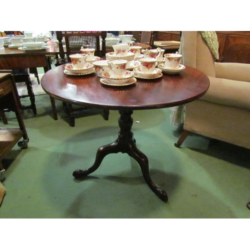 4208 - A George III flame mahogany circular tilt top wine table on a turned column and tripod base with ori... 