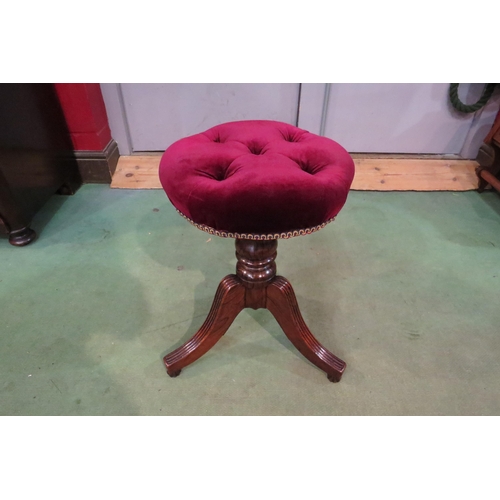 4252 - An early Victorian faux rosewood piano stool, the height adjustable revolving buttoned circular seat... 