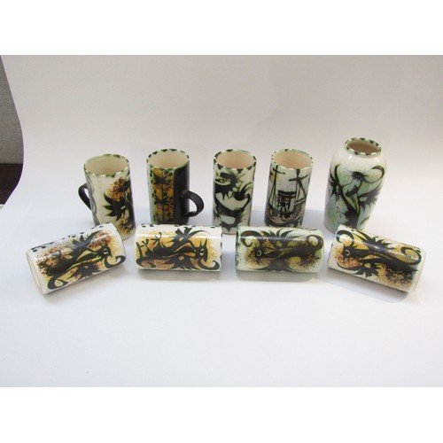 4302 - Eight Celtic pottery mugs of various designs, 13cm high and a Phoenix pattern vase, 16cm high