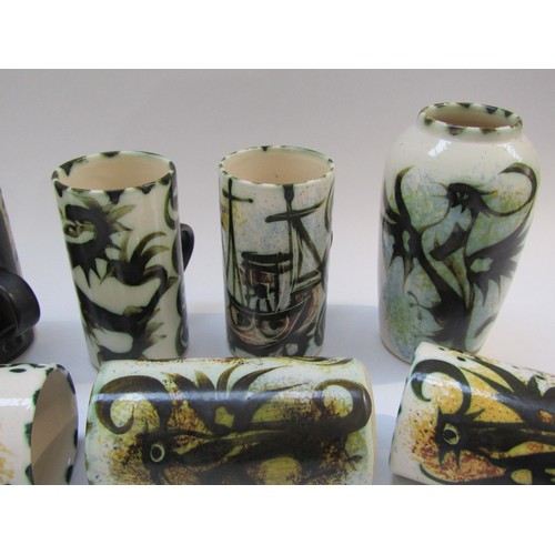 4302 - Eight Celtic pottery mugs of various designs, 13cm high and a Phoenix pattern vase, 16cm high