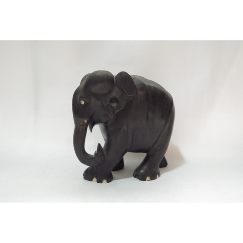 4342 - An Eastern hardwood elephant, 20cm tall