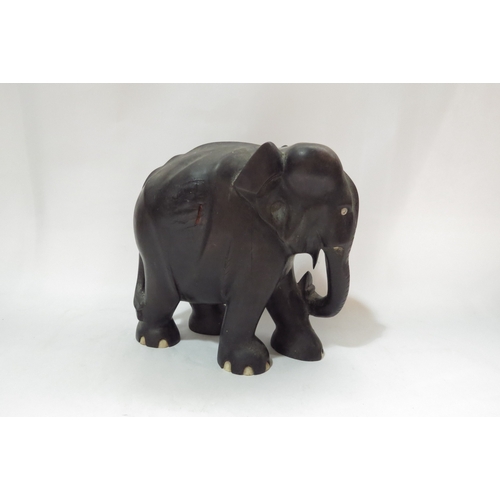 4342 - An Eastern hardwood elephant, 20cm tall