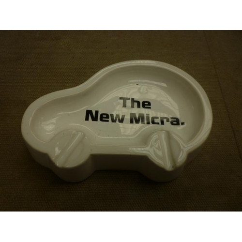 6143 - A ceramic Nissan ashtray 'The New Micra' - some cracks to glaze