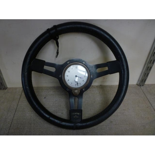 6148 - A Smith's motoring clock set in a Mountney steering wheel