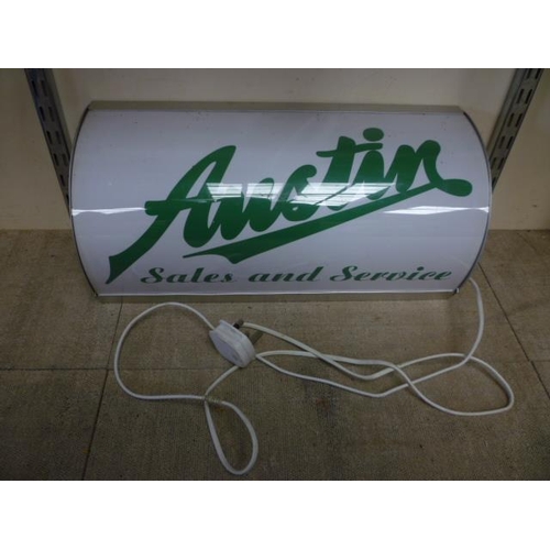 6150 - An illuminated Austin Sales & Service sign.  DTI FAILURE: Please see information pages