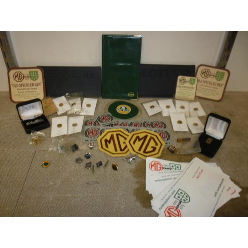 6170 - A box containing Lotus and MG promo items including pin badges, Lotus wallet, two Lotus diaries, a t... 