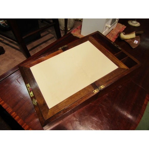 4232 - A mahogany brass mounted writing slope, brass cartouche and escutcheon  (R)  £20