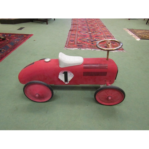 4239 - A push-along toy racing car, red No. 1, faux gas cap