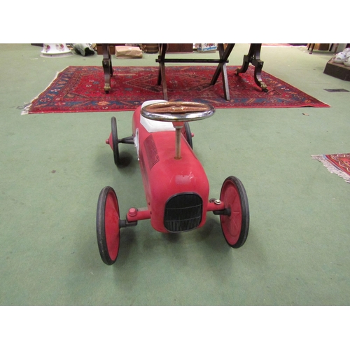 4239 - A push-along toy racing car, red No. 1, faux gas cap