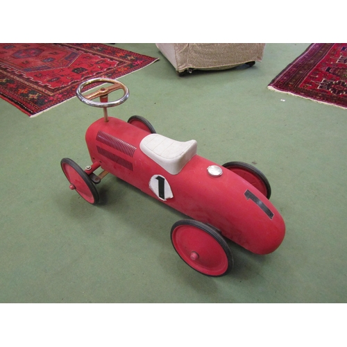 4239 - A push-along toy racing car, red No. 1, faux gas cap