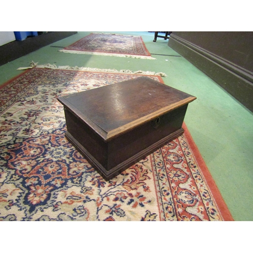 4261 - An oak box, brass escutcheon, plinth base, (lid loose) 34cm long x 22cm wide x 14cm deep     (R) £30