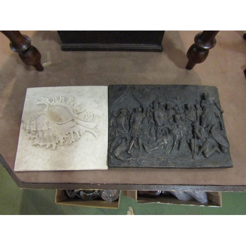 4262 - A faux marble plaque of shell in high relief, 24cm x 24cm, and a resin plaque depicting knights in b... 