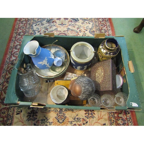 4271 - A box of assorted items to include Jasperware jug and barrel, carved wooden box, drinking glasses et... 