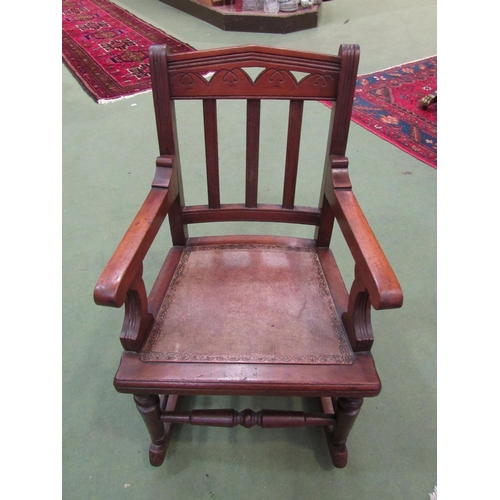 4011 - A late Victorian child's walnut rocking chair  (R)  £50