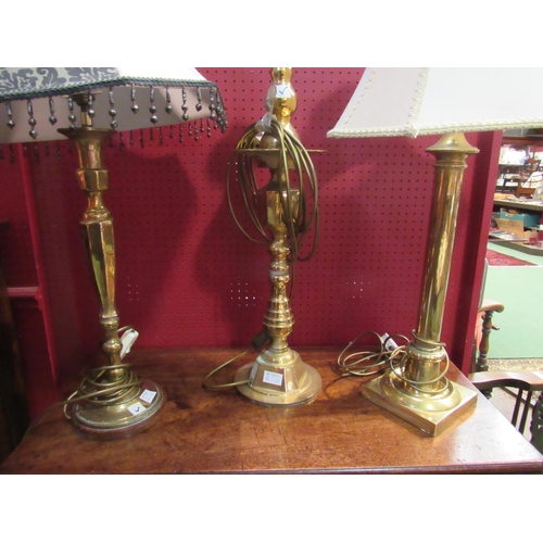 4064 - Three brass table lamps including column and twisted form stems