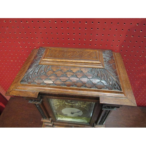 4097 - A Mahogany Elkington & Co. bracket clock, carved case and column form front, ornate decoration to fa... 