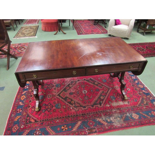 4108 - A Regency flame mahogany country house sofa table with black line inlay, the rising leaves over two ... 